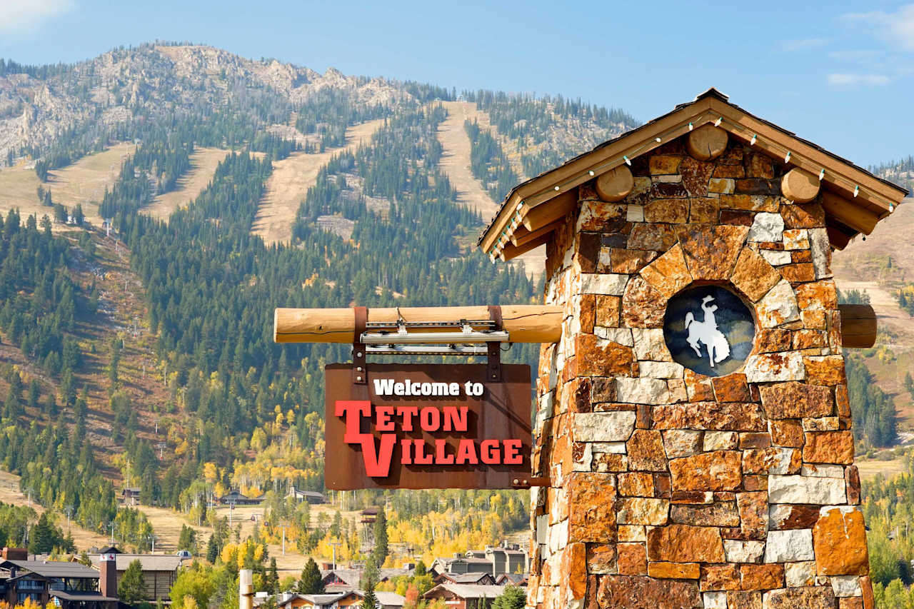 Panoramic view of luxury ski-in, ski-out homes in Teton Village at the base of Jackson Hole Mountain Resort, showcasing Jackson Hole real estate options with mountain scenery.