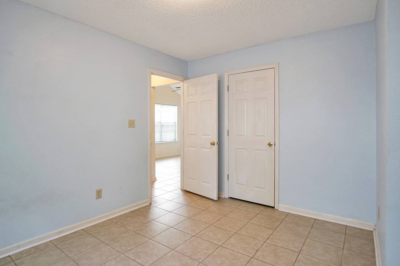 photo of second bedroom with a view of the main living area at 2709 Oak Park Court, Tallahassee, Florida 32308