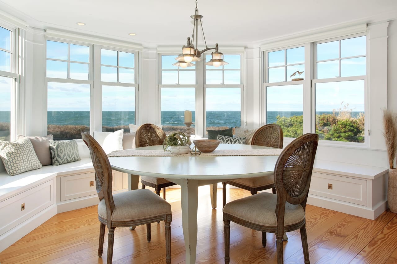 staged dining room with ocean view