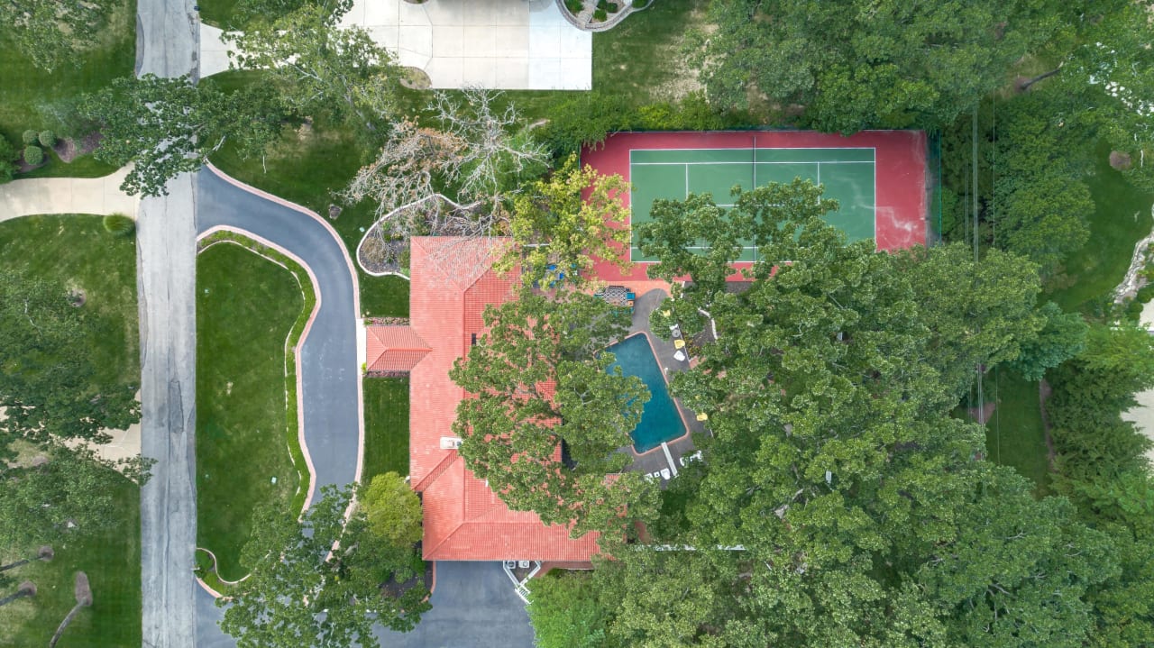 A Special Retreat on a Prized One Acre Lot With Pool and Tennis Court