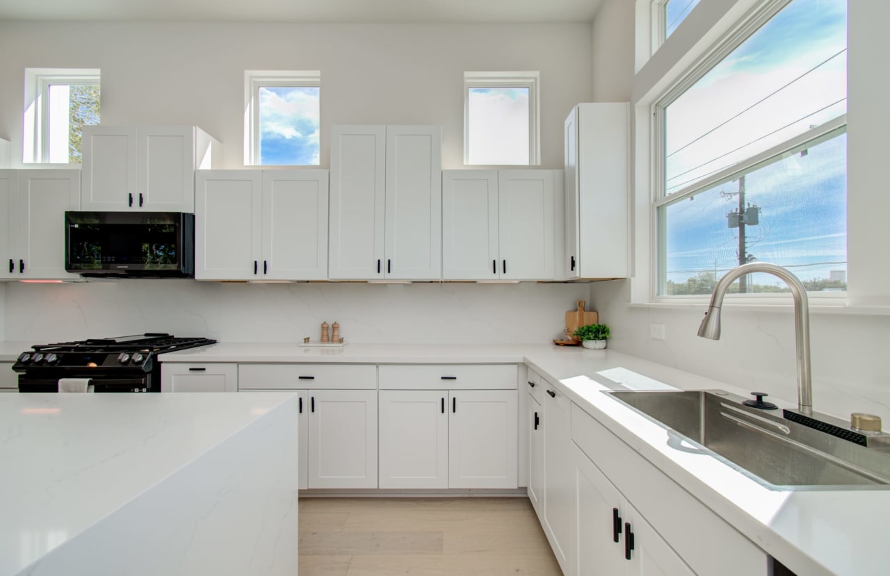 kitchen with large white countertops