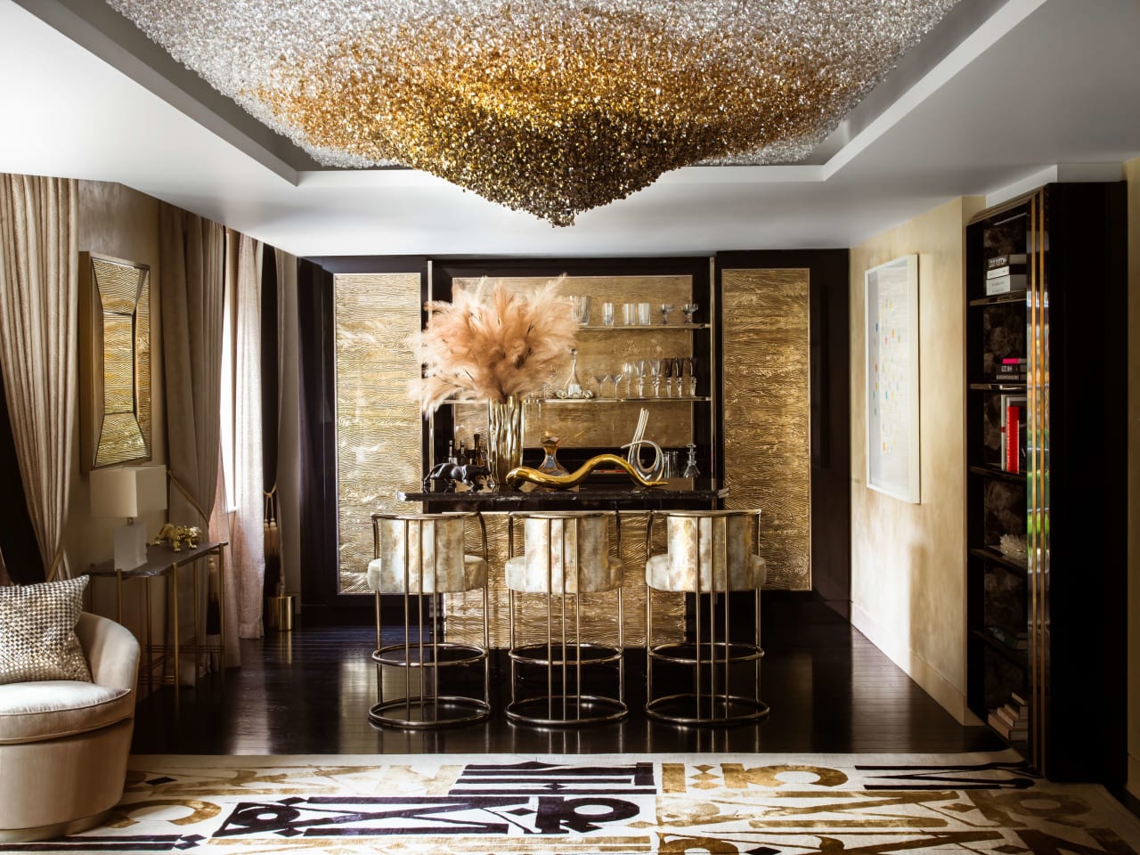 A luxurious living room with a built-in bar, a chandelier