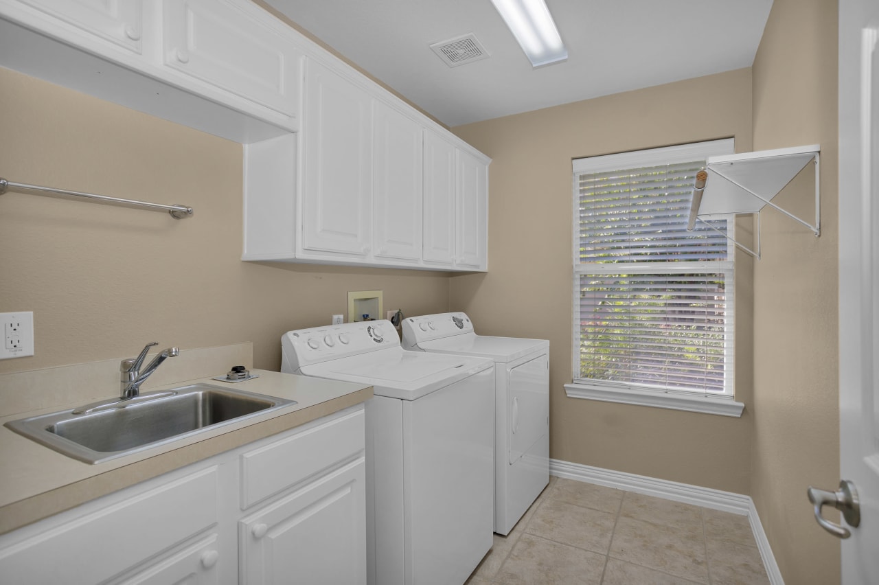 Large Laundry room with sink and lots of storage!