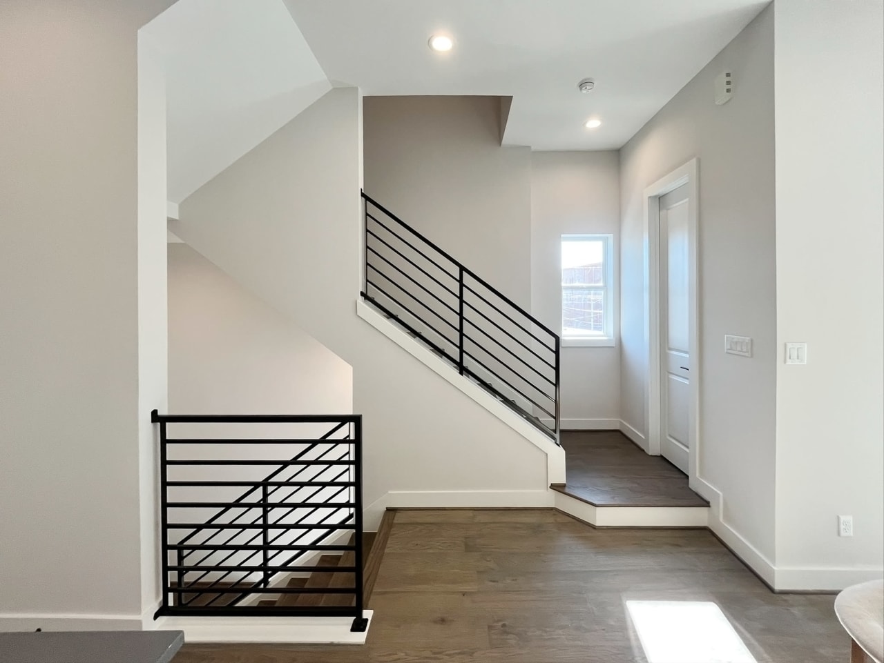 hallway and staircases at an Eastwood Estates home