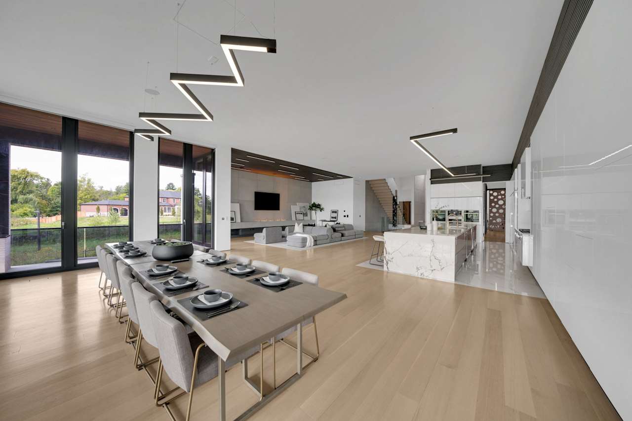 A spacious dining room with an expansive table at its center