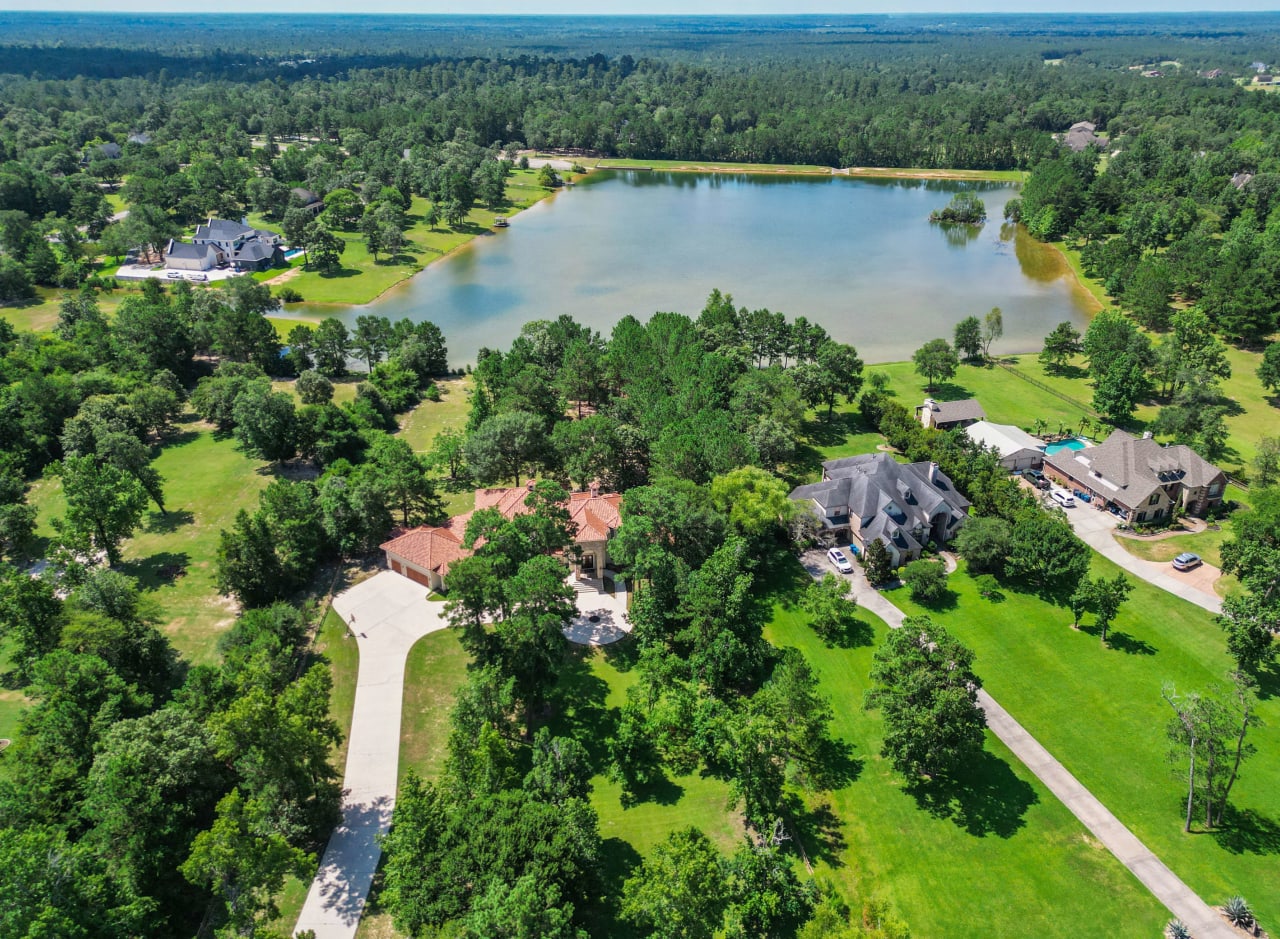 Welcome to 11380 Majestic Drive...2+ acre WATERFRONT lot with Lovely Mediterranean-style custom home!