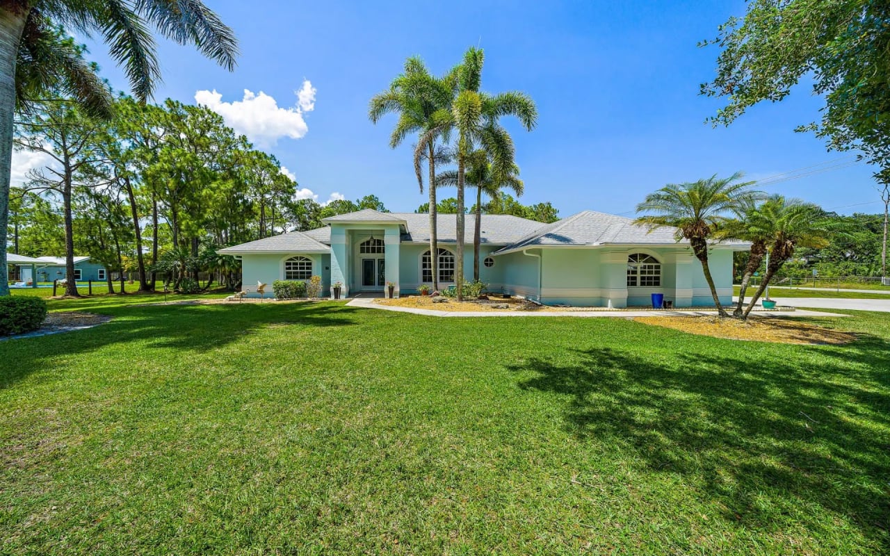 Tour This Stunning Corner Lot Jupiter Farms Pool Home!