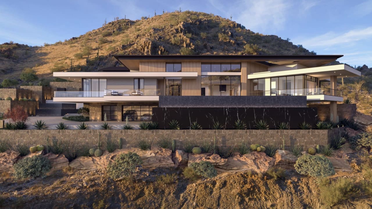 Luxury modern estate on hillside lot with mountain views