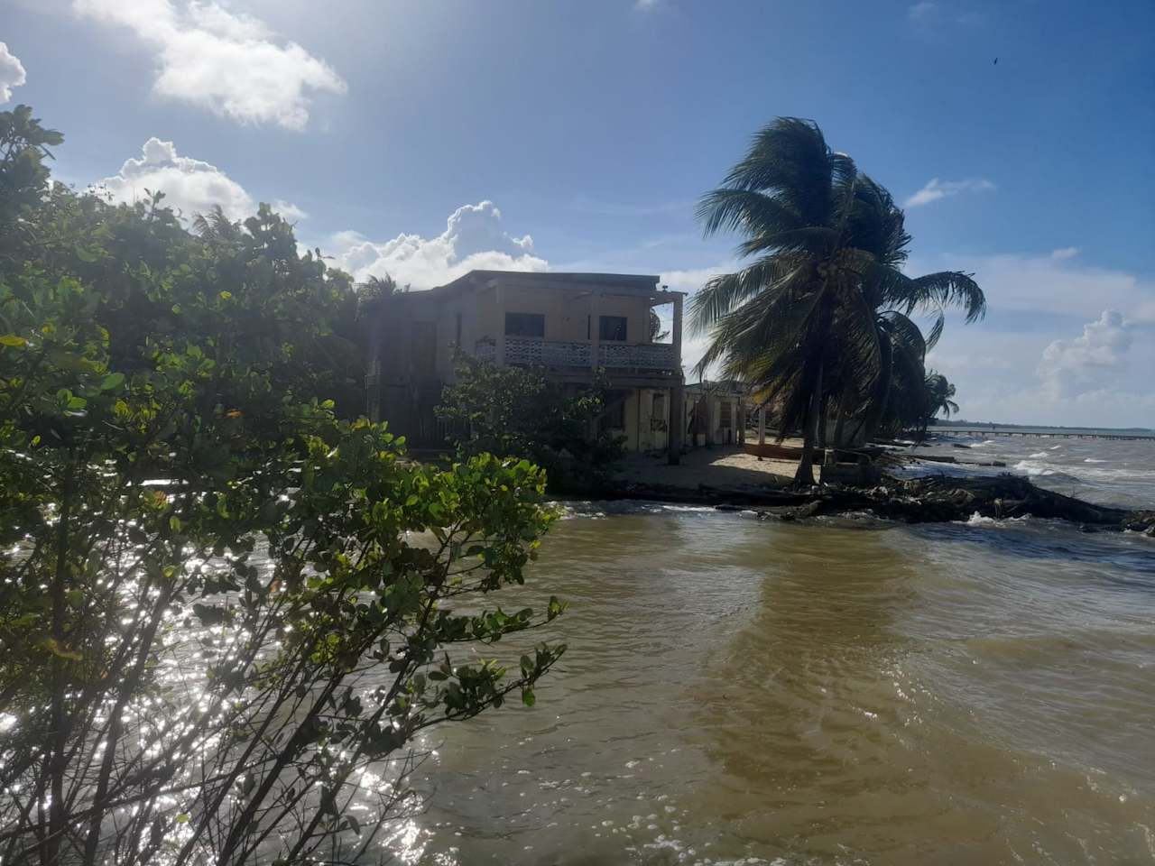 Charming 1.6 acre Caribbean Beachfront peninsular in Dangriga Town, Belize