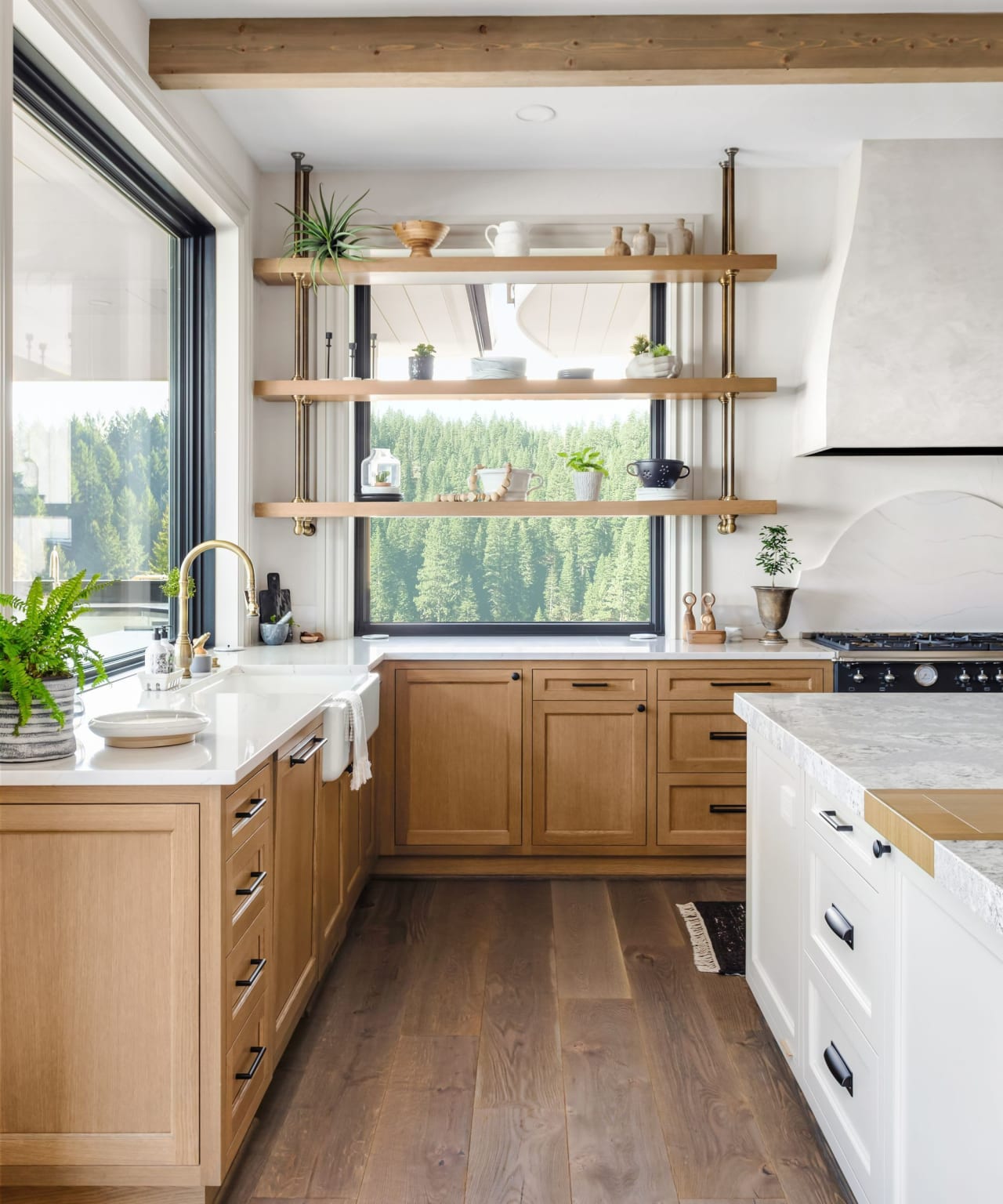 A bright and airy kitchen with wooden cabinets lining the walls.