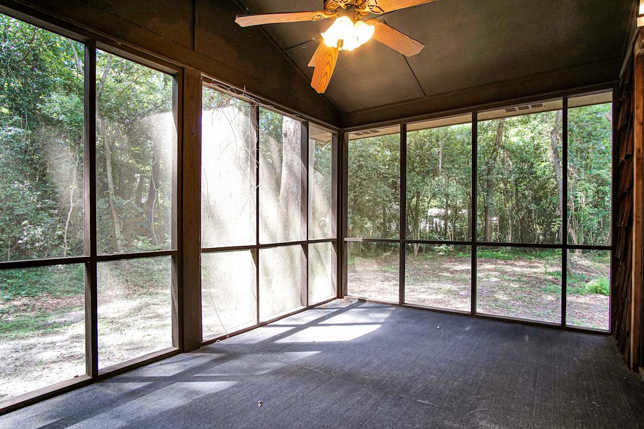  Photo of the primary screened in patio overlooking the backyard