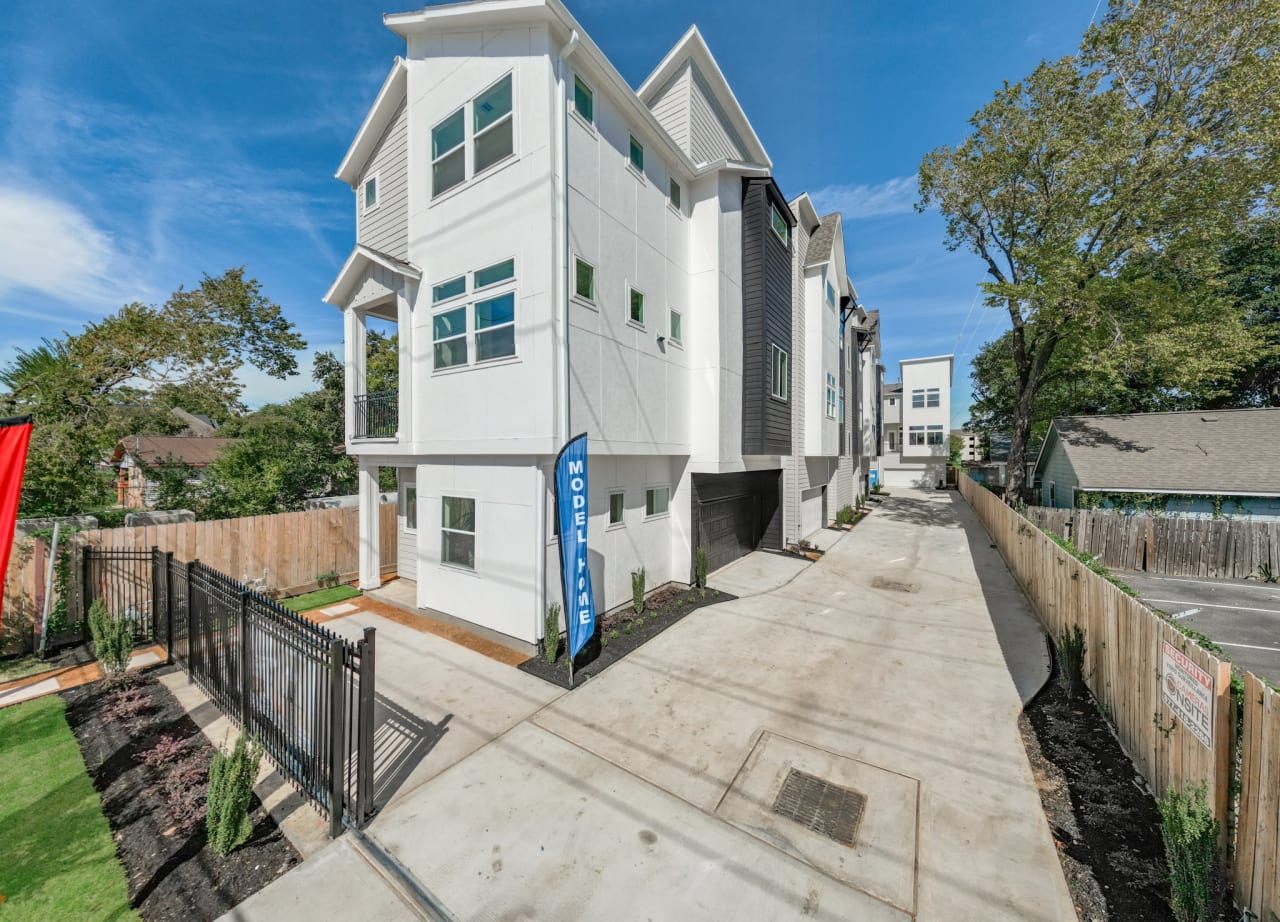 a row of new homes by Oracle City Homes