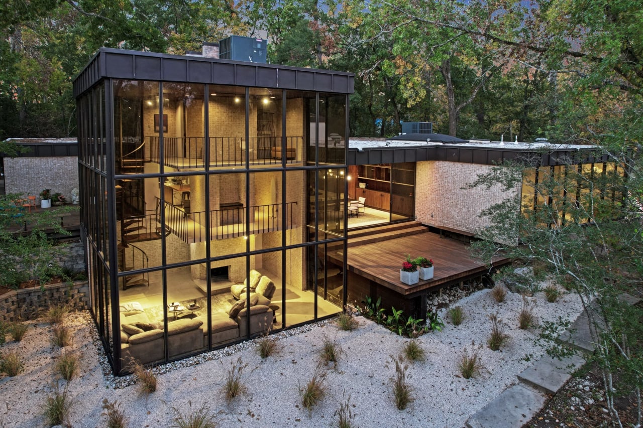 Walls of glass encase this midcentury modern retreat overlooking Buffalo Bayou