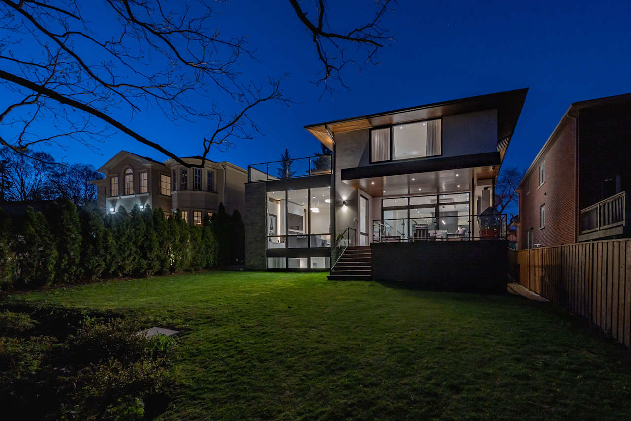 A modern house with a large backyard