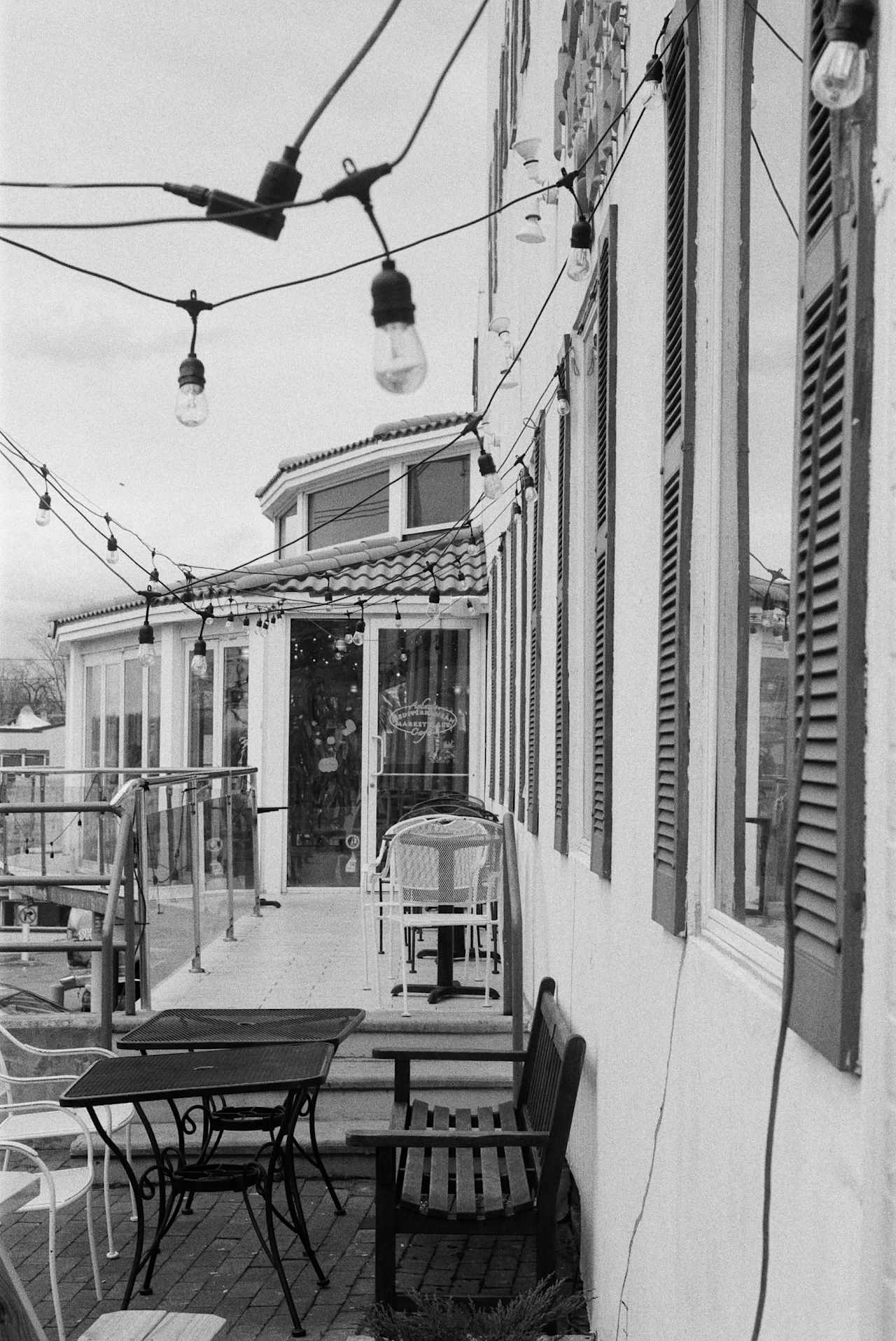 A captivating black and white photo of an outdoor bistro, evoking a timeless ambiance.