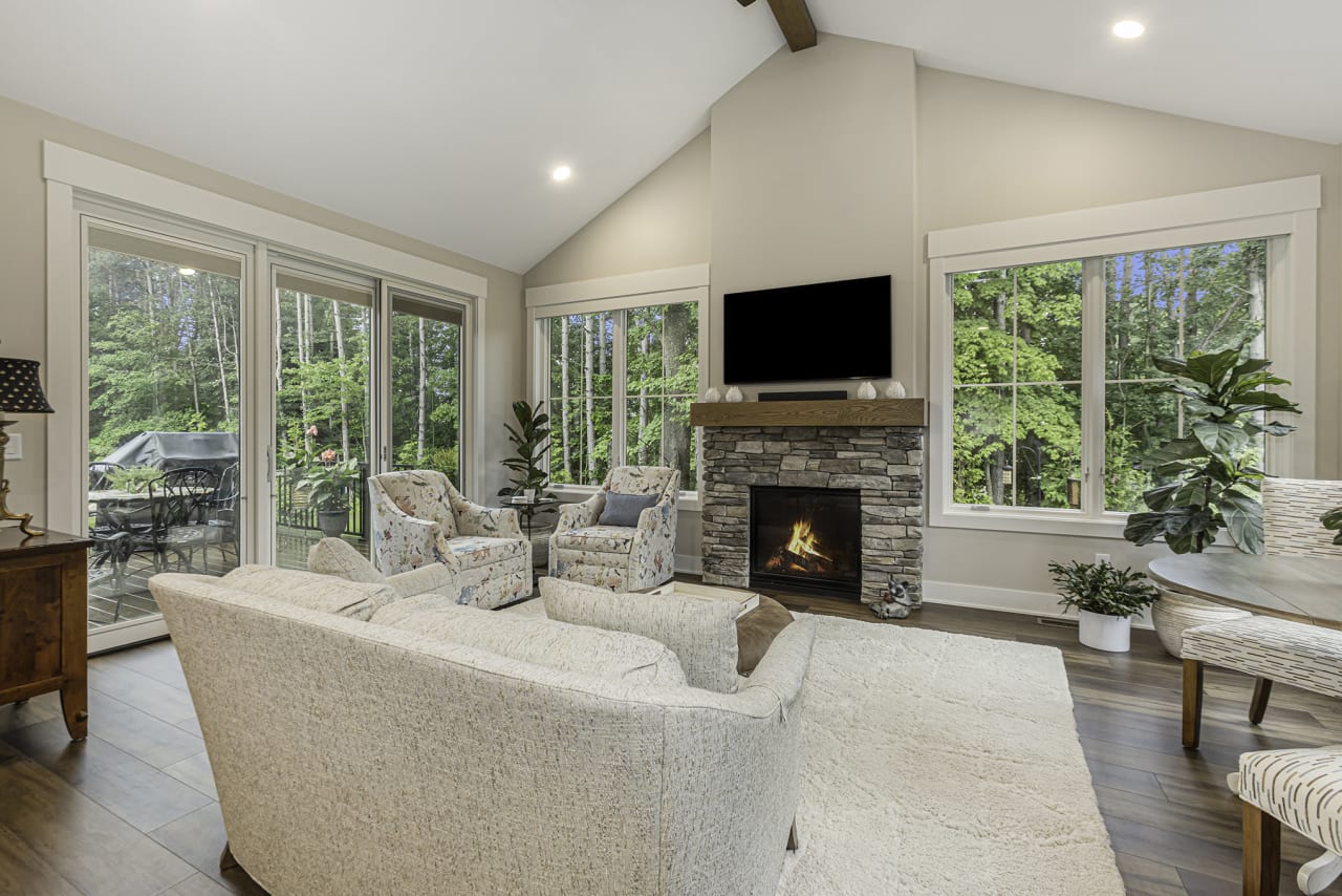 living area with fireplace and large windows