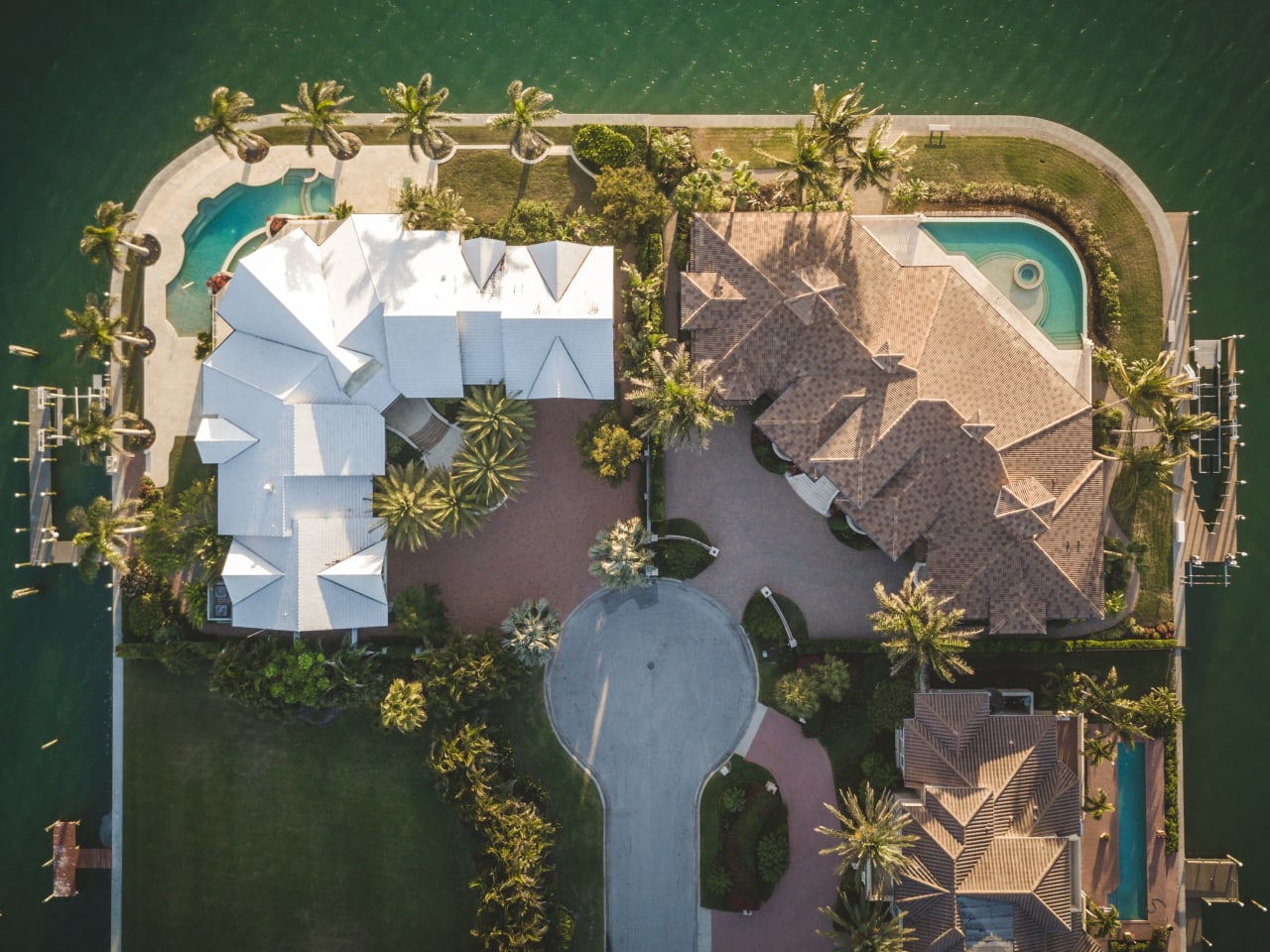 Aerial view of a mansion surrounded by palm trees in Lakewood Ranch