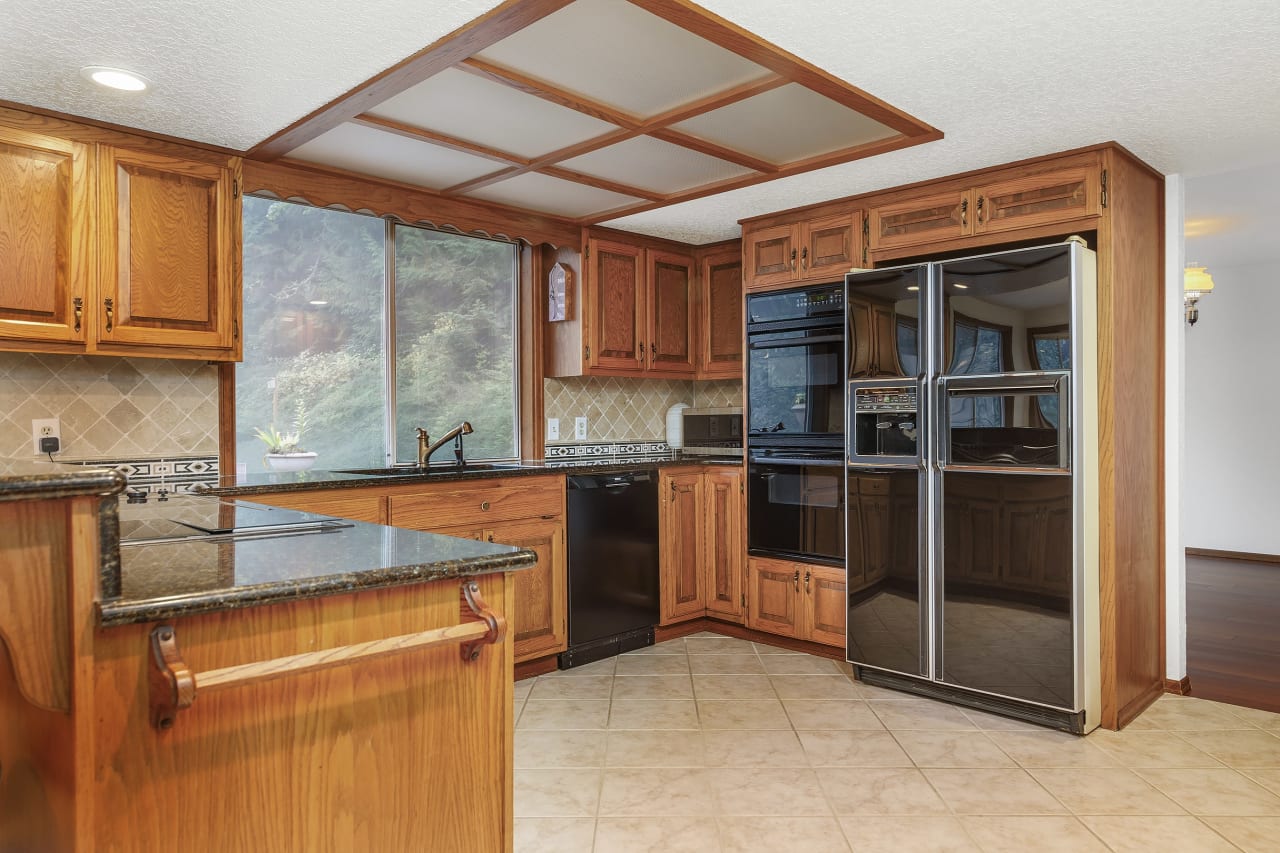 An additional highlight of the kitchen is the heated tile floor, ensuring your comfort during those chilly mornings and adding a touch of luxury to your daily routine.