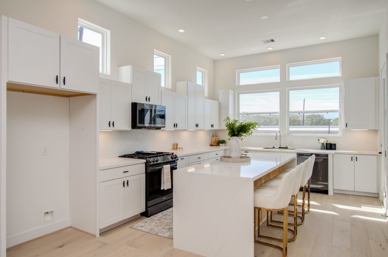 model kitchen with white walls and countertops 