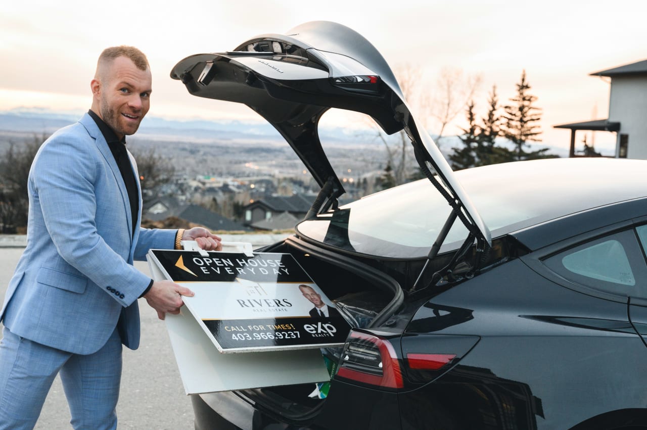 Spencer Rivers: Best Realtor Calgary and His Tesla after a Successful Home Deal