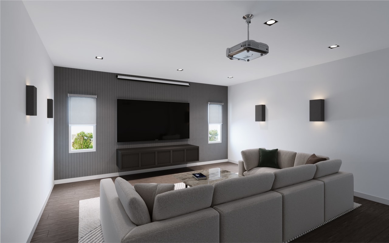 Comfortable home theater room featuring a cozy grey sofa and ambient sconces, creating the perfect setting for movie nights.