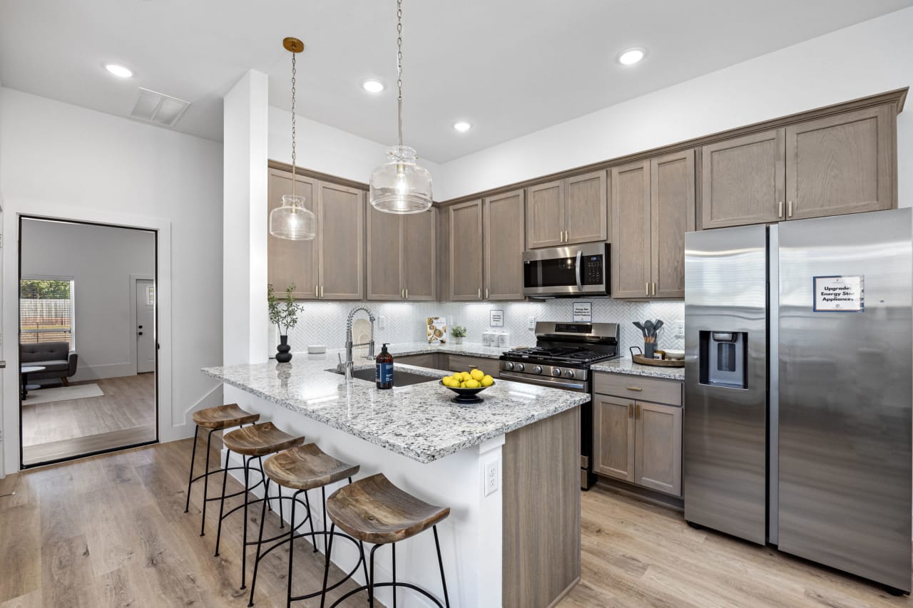 model kitchen area with a breakfast bar