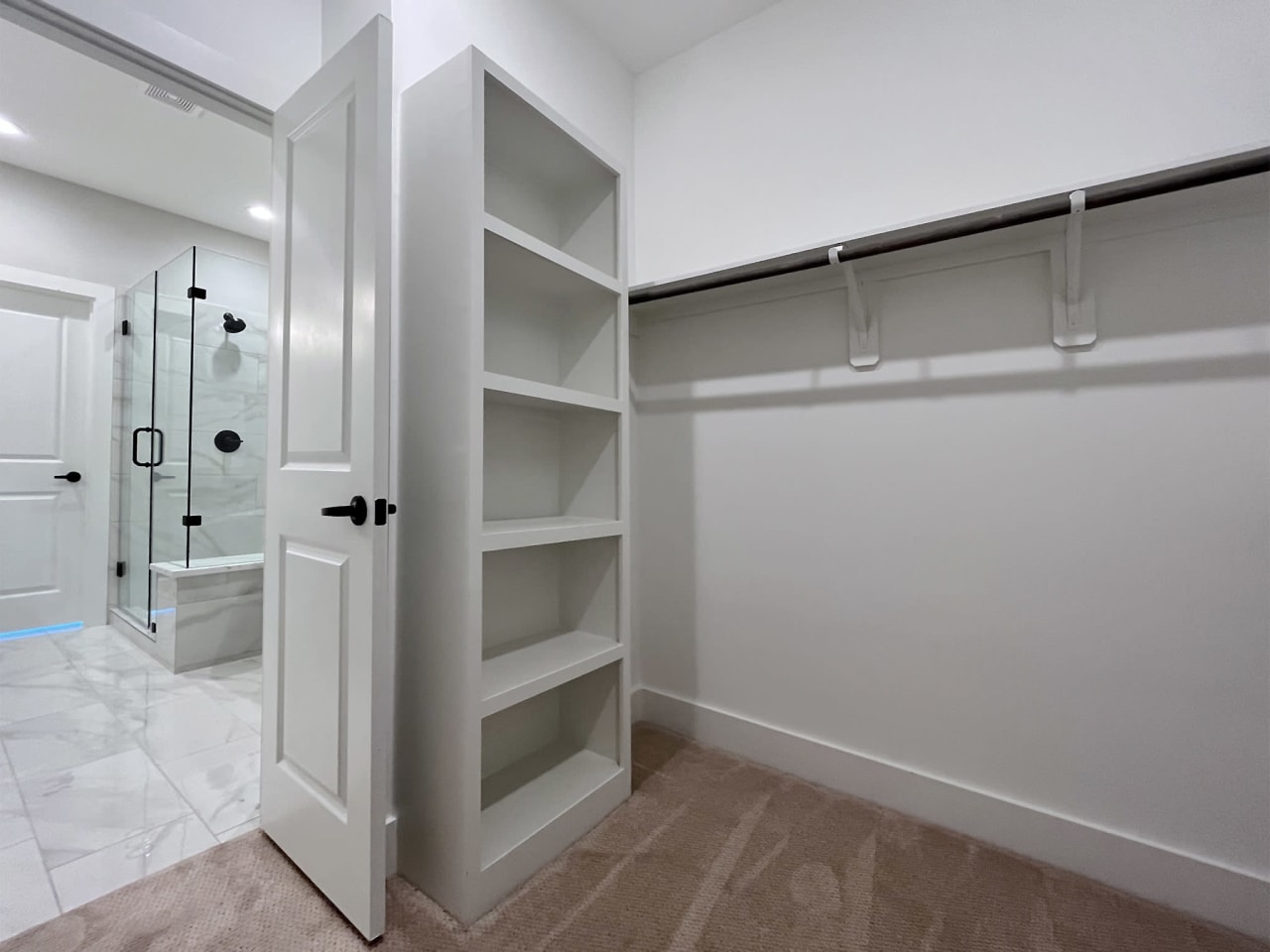 large walk-in closet in a townhome by Oracle City Homes