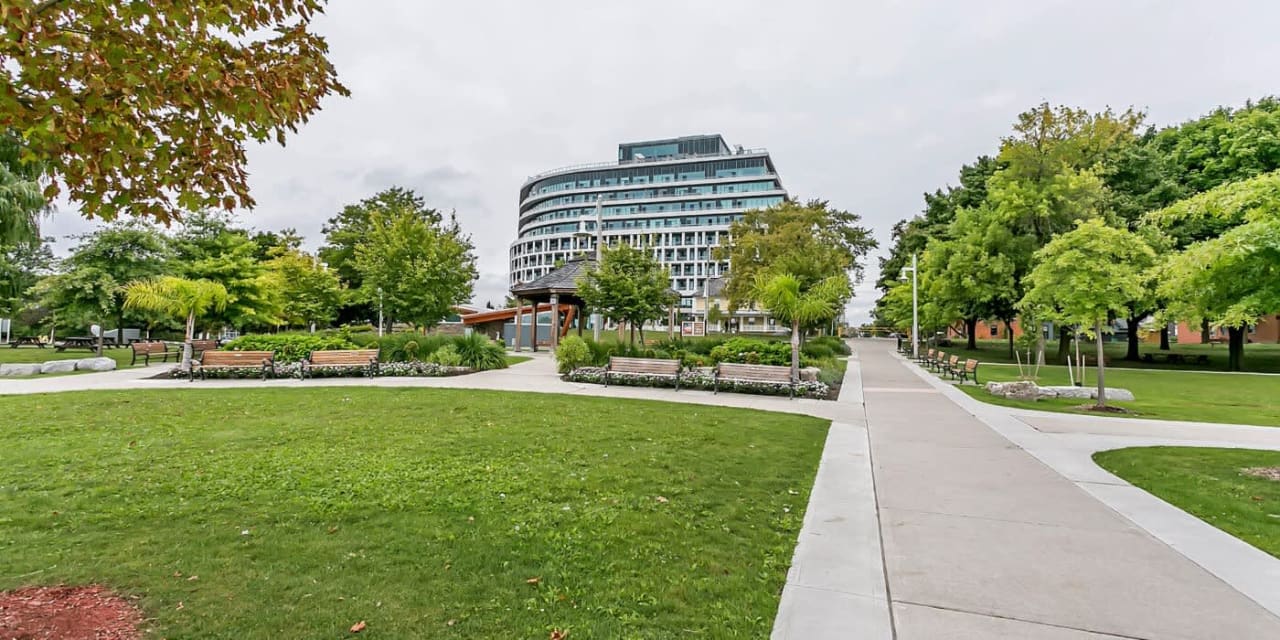 A park with a building in the background.