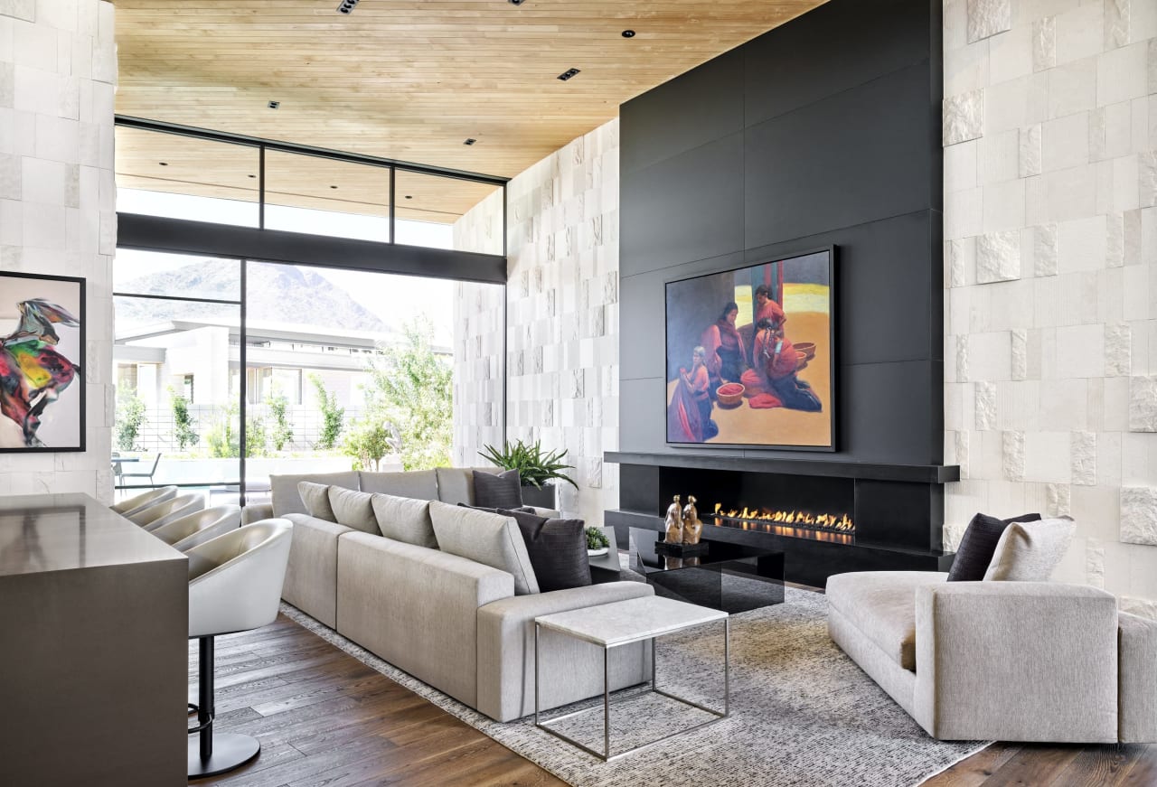 Modern living room with stone and mountain views