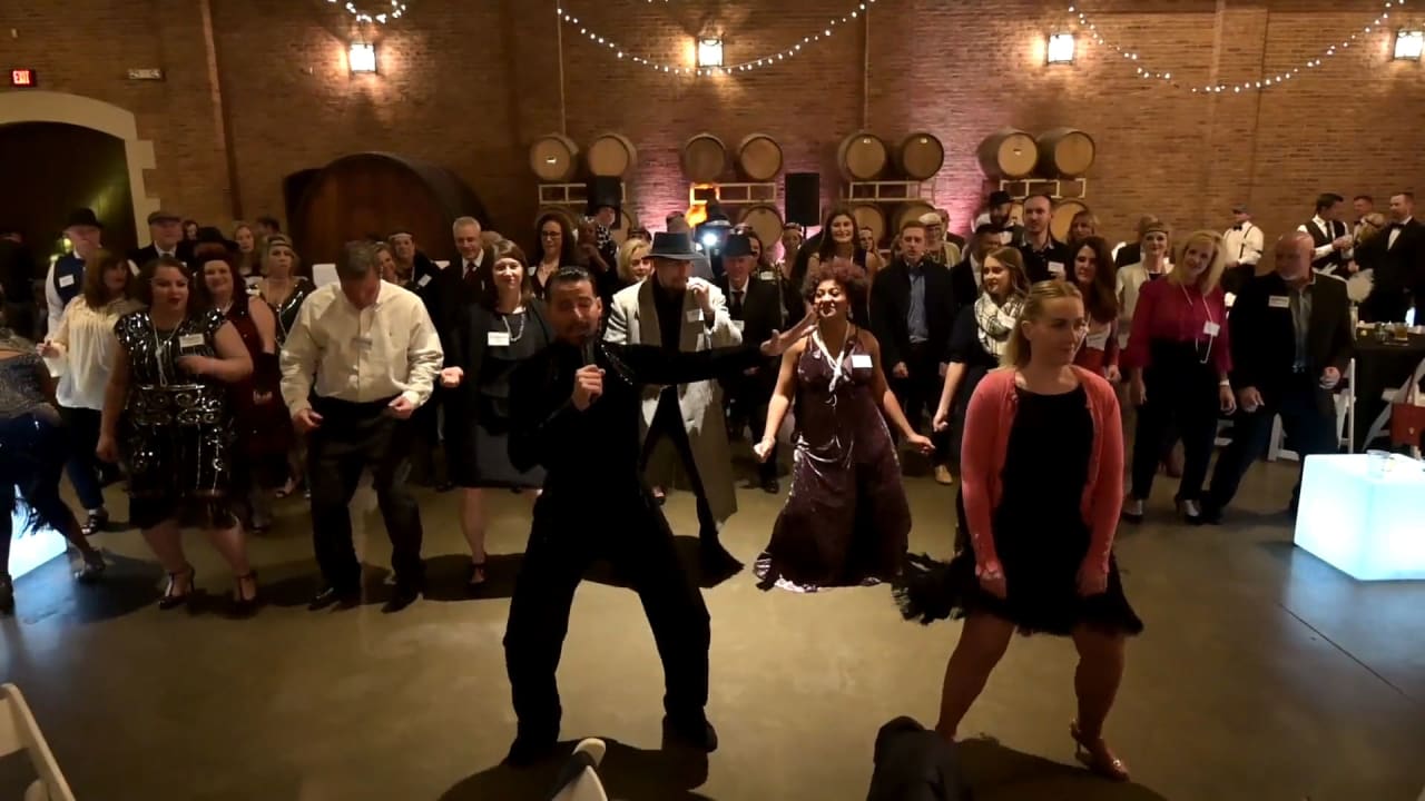 People dancing and having fun on a party dressed in  formal attire