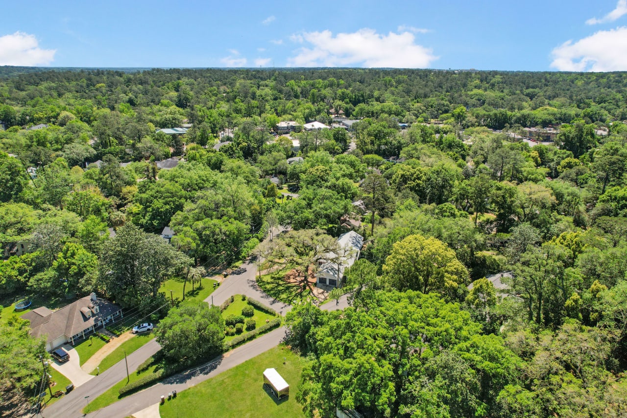 An aerial view of the Glendale neighborhood, showing houses, streets, and significant greenery.