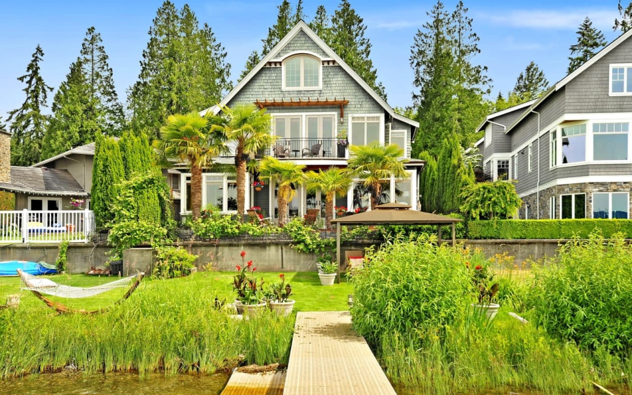 House with dock and hammock on lake