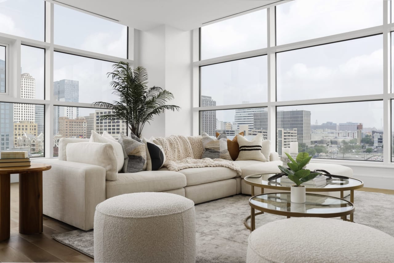 Stylish and modern white living room setup from Elite Austin's premium furniture rental