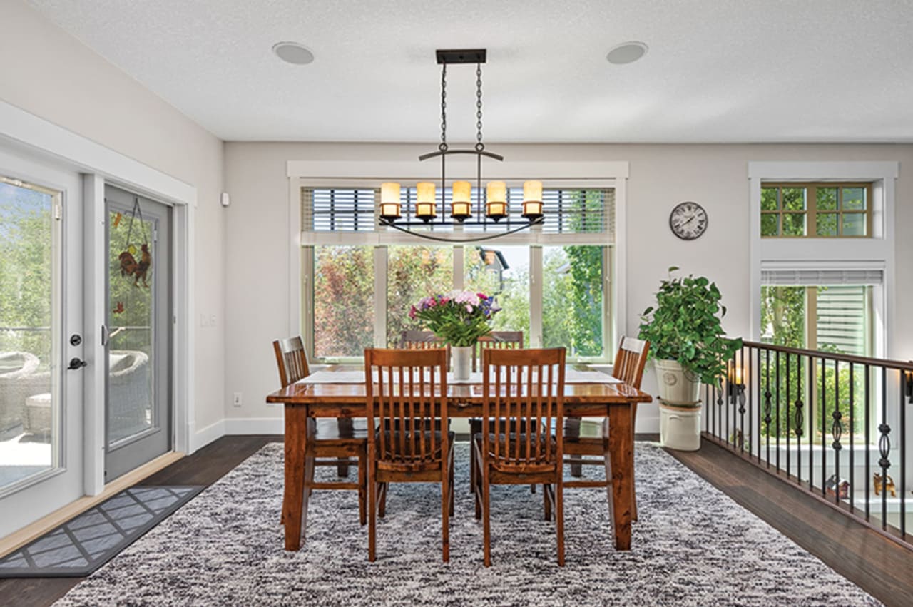 A beautiful dining room with a wooden table and chairs