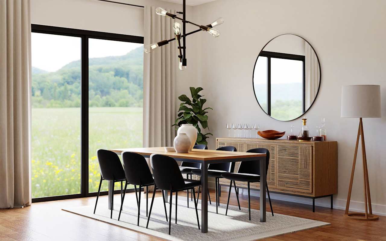 A modern dining room with a long rectangular table and black chairs.