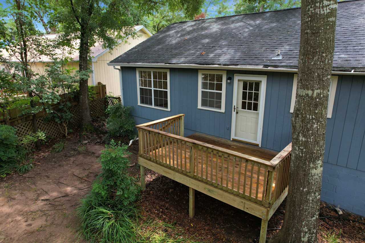 Drone or aerial photo of back deck with stone pathway