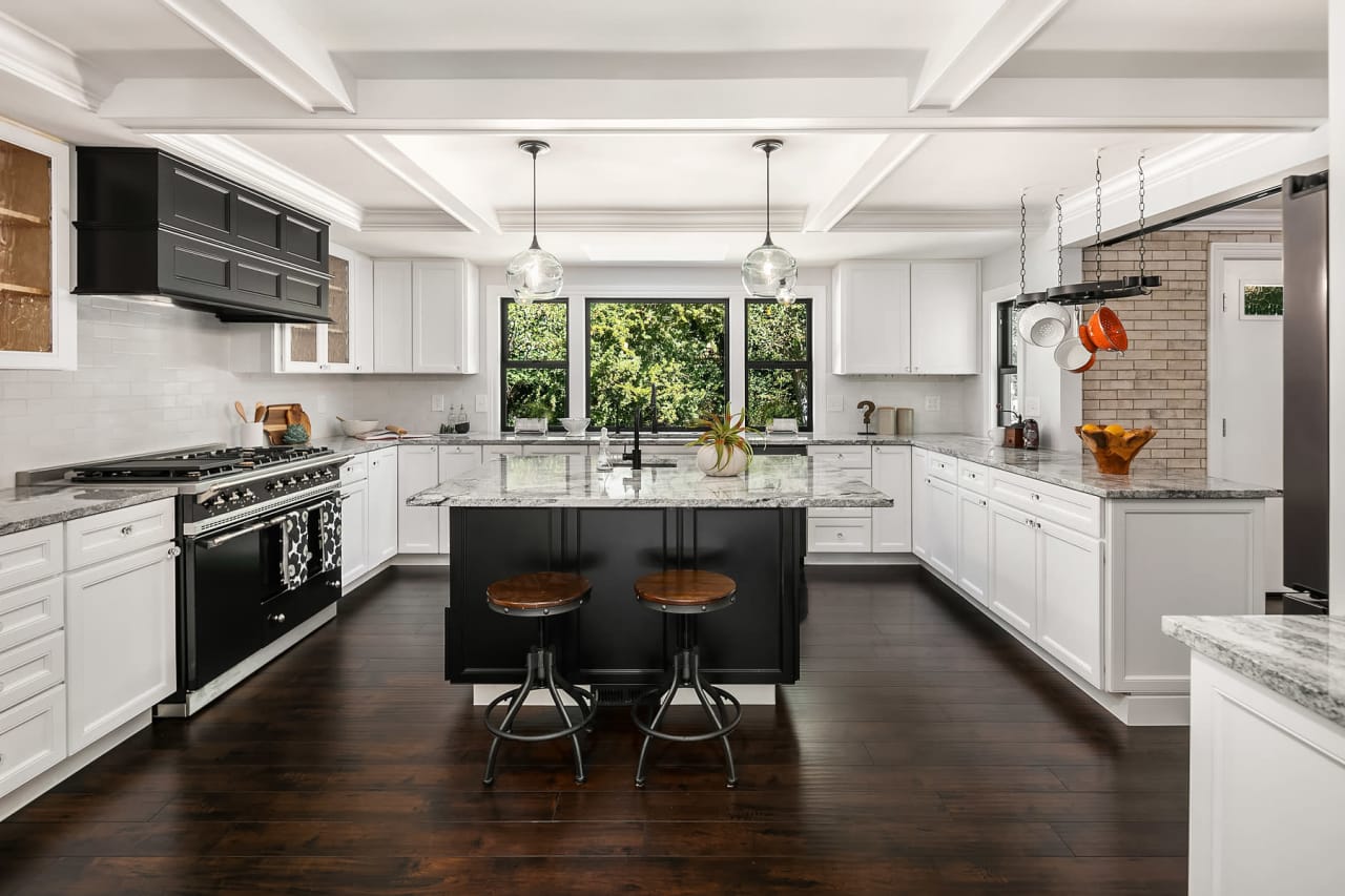 updated kitchen with black accents and white cabinets in normandy park