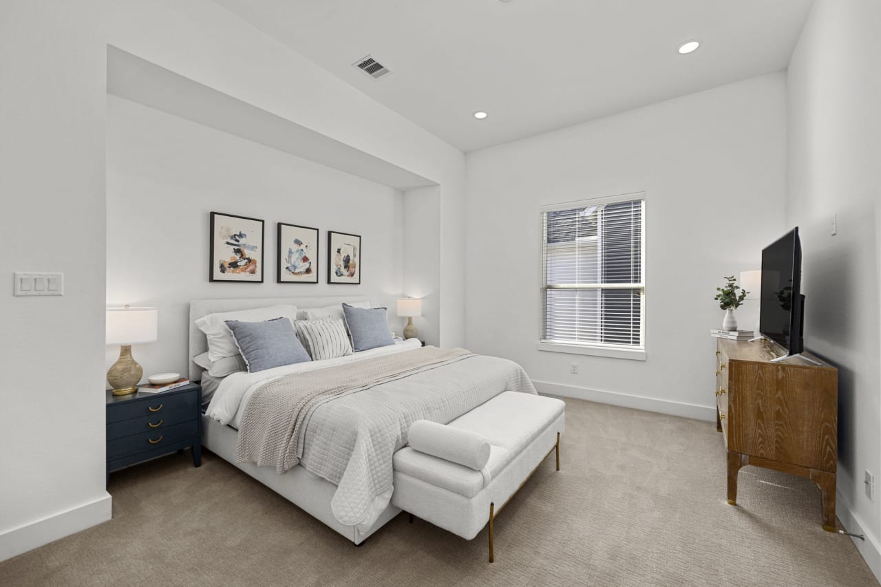 master bedroom with decorative pillows 