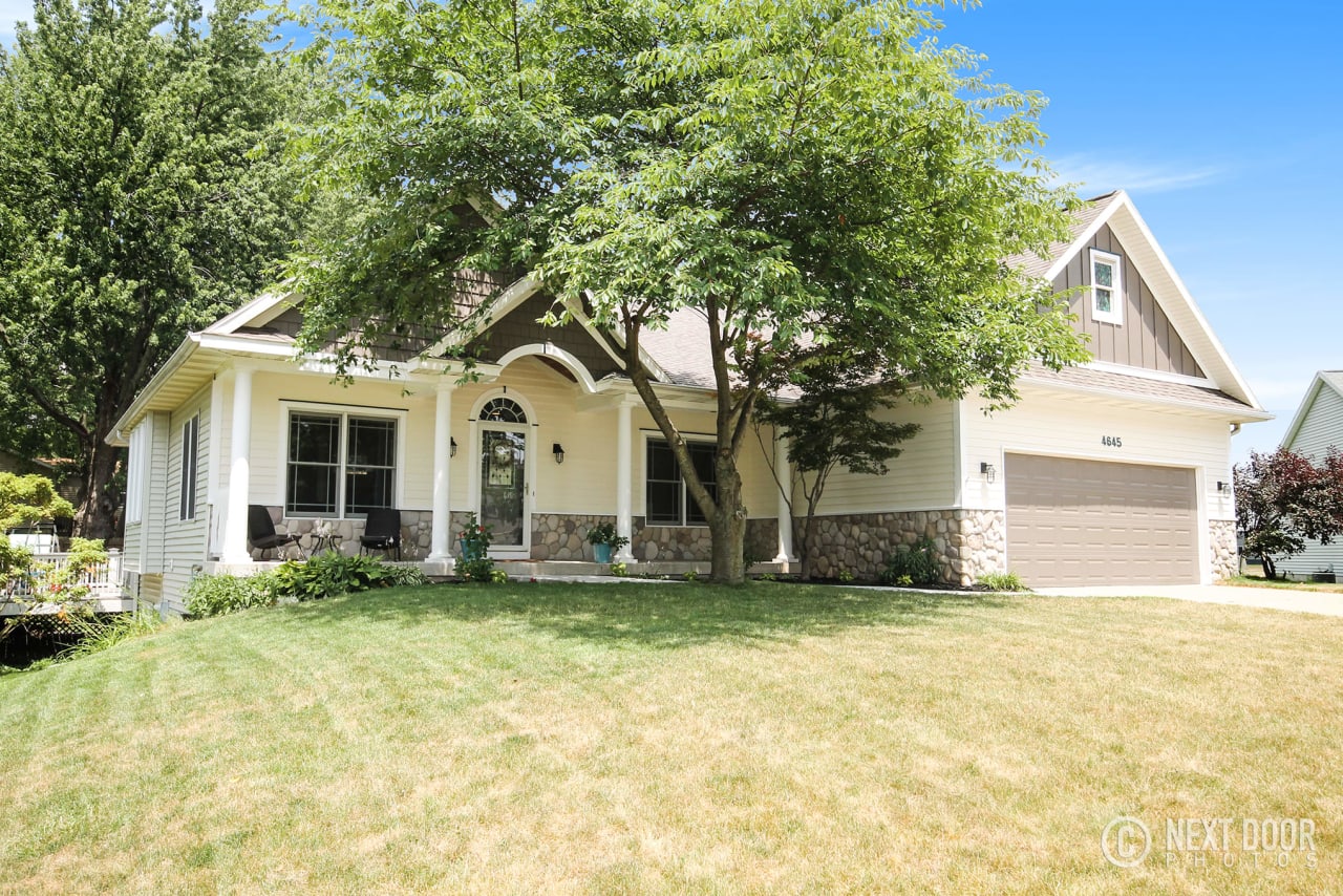 modern house with large mowed lawn in Kentwood