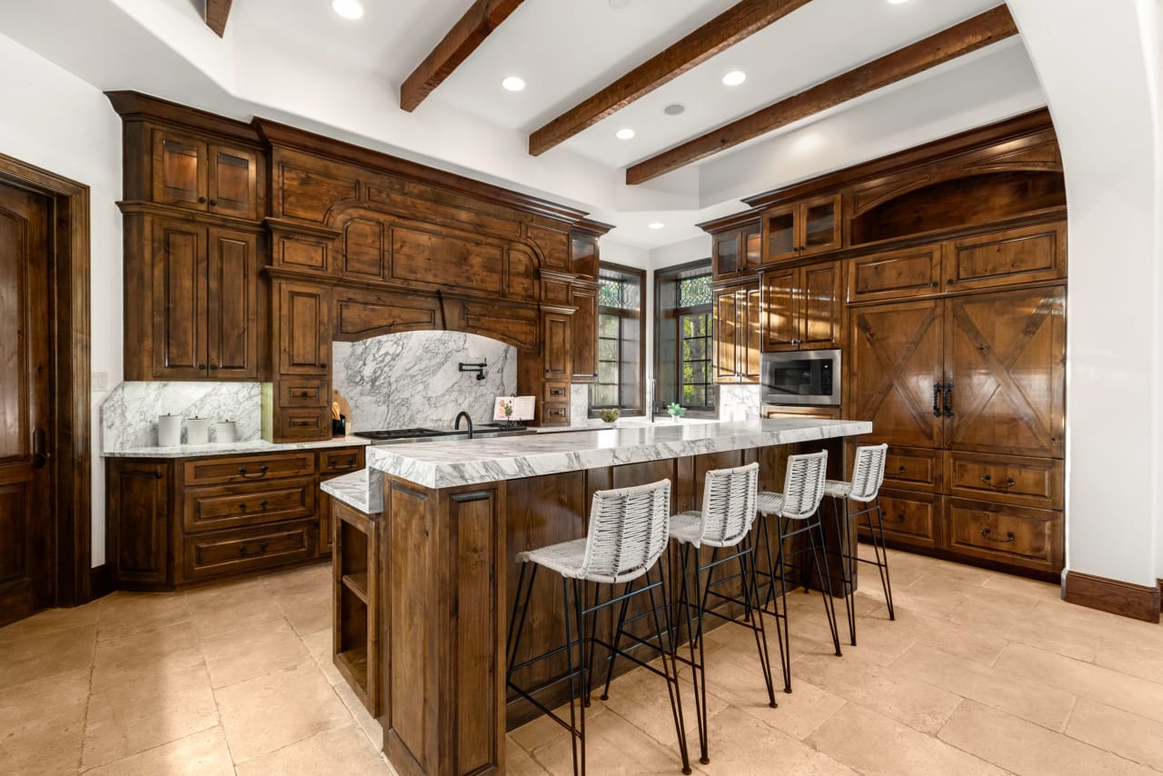 Dining room showcasing Elite Austin's rental of a wooden brown dining table set, adding warmth and elegance to the space