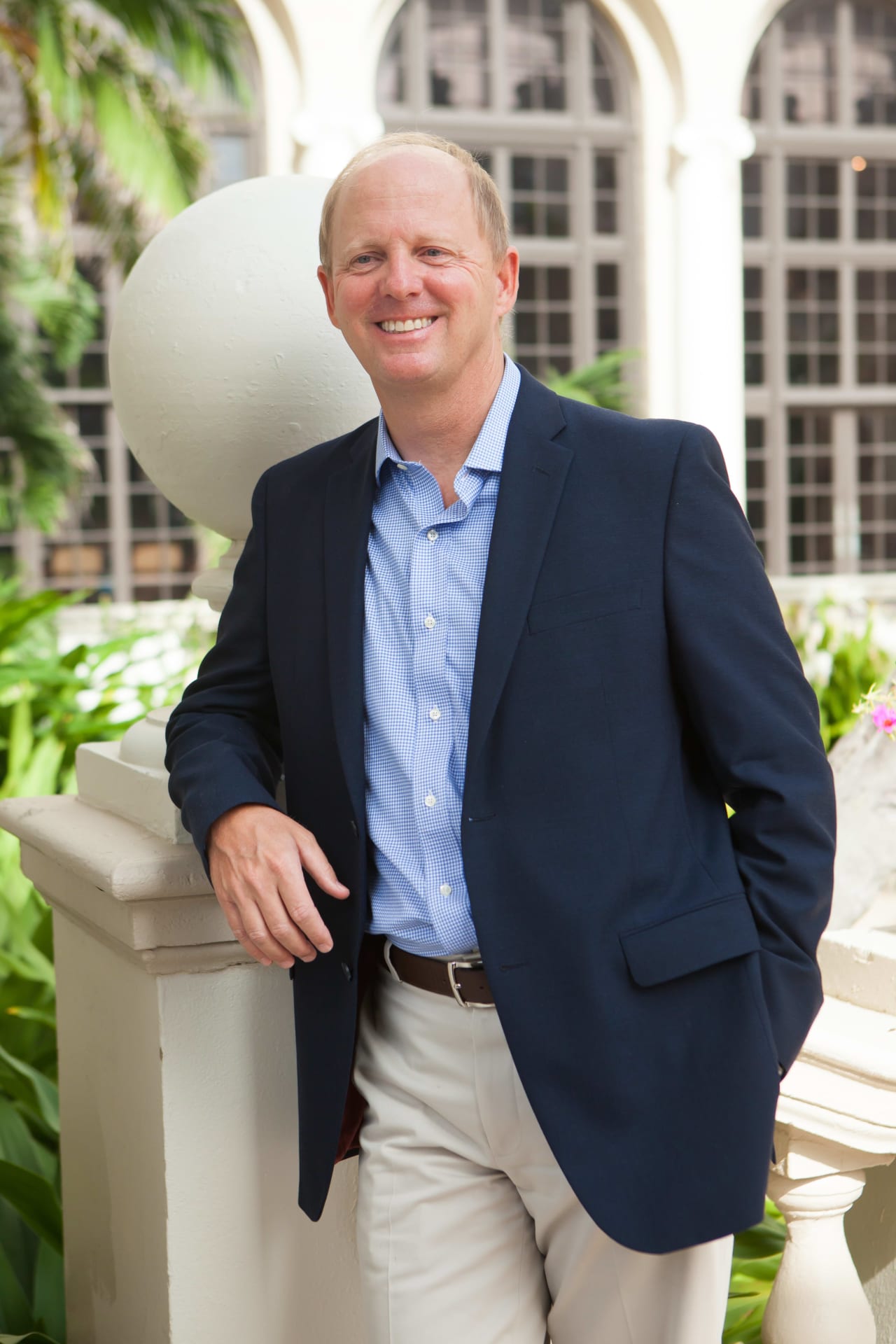 A headshot of Roger Pettingell wearing blue suit