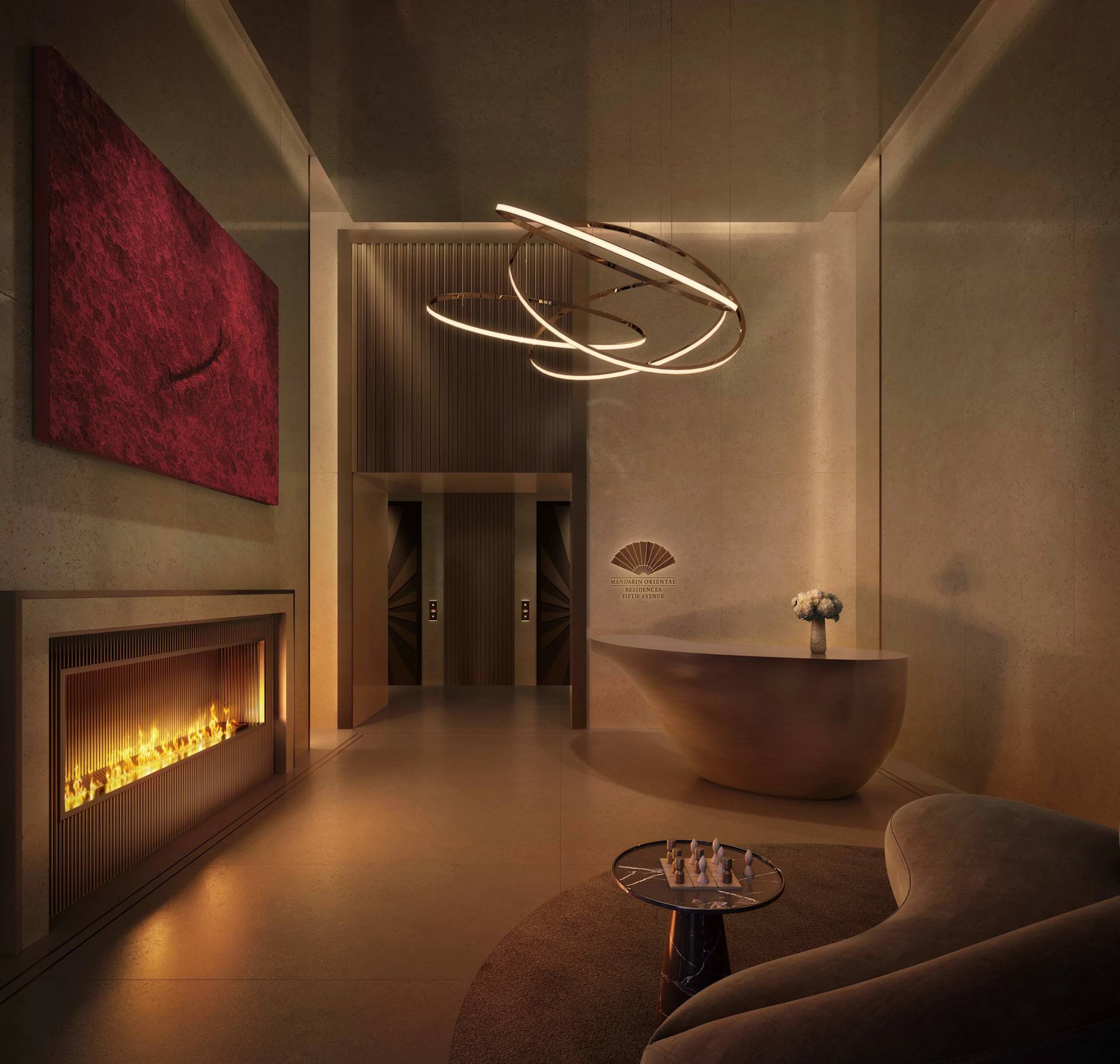 Mandarin Oriental Residences Fifth Avenue lobby with a sculptural chandelier and linear fireplace.