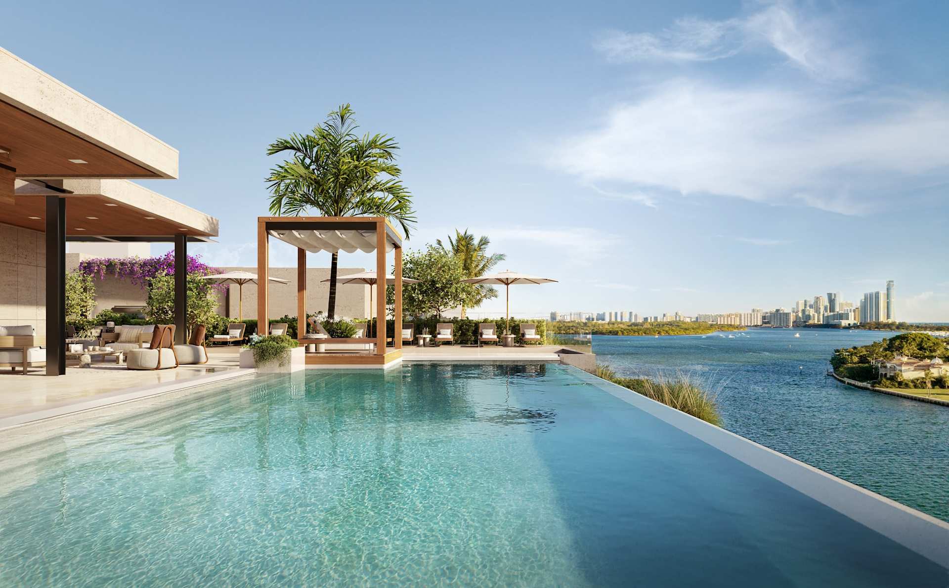 Rooftop pool terrace overlooking the bay, with pergolas, palms, and the Miami skyline in the distance.