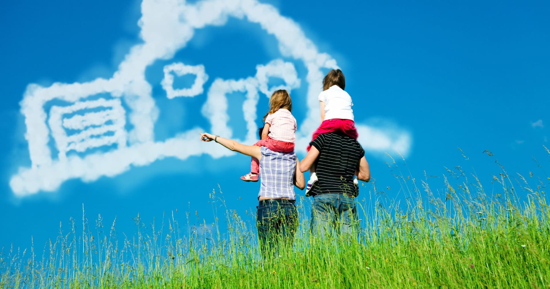 Two adults carry children through a grassy field beneath a cloud shaped like a house.
