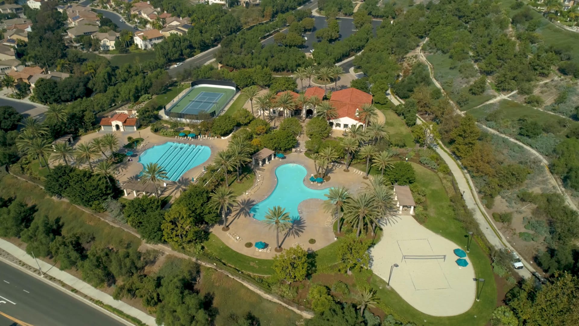 Aerial view of the swimming pools and sand courts at the Athletic Club