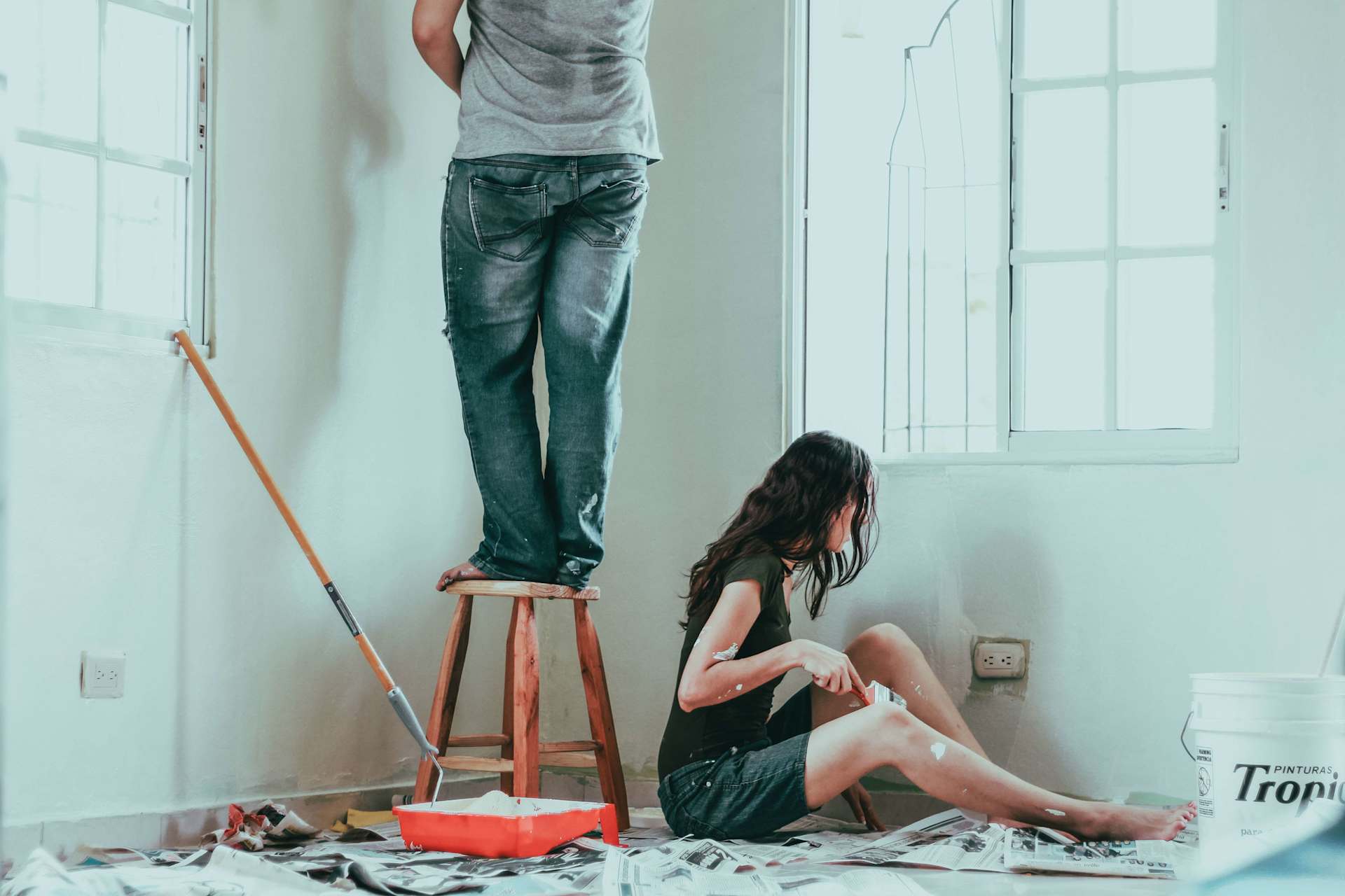 A couple renovating a room.