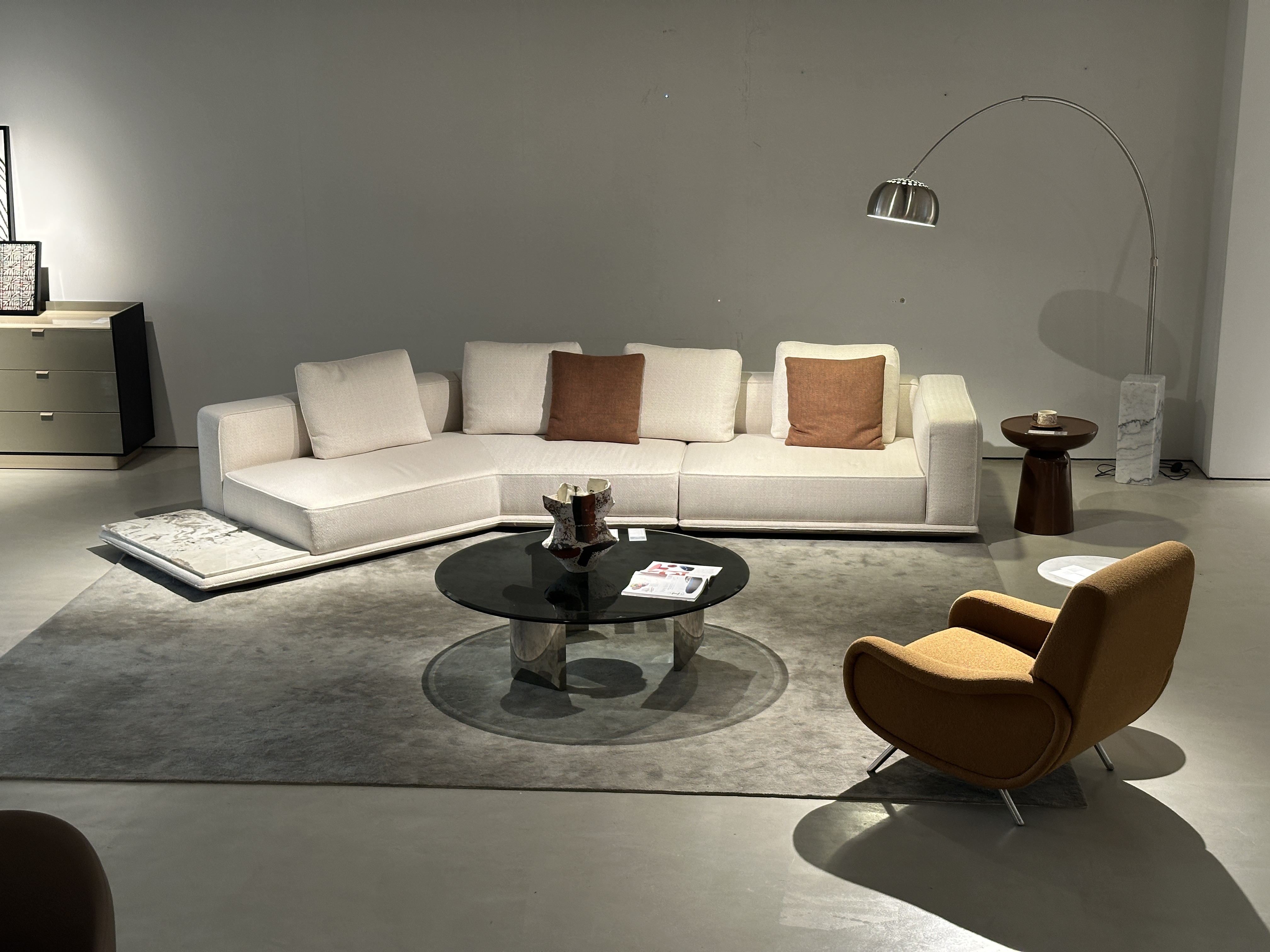 Angled floating modular sofa showing integrated marble platform table