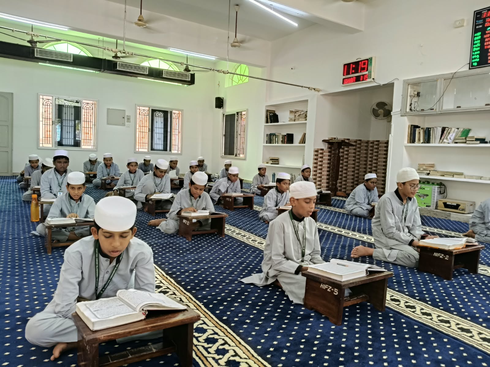 Classical Islamic reference books opened on a study desk