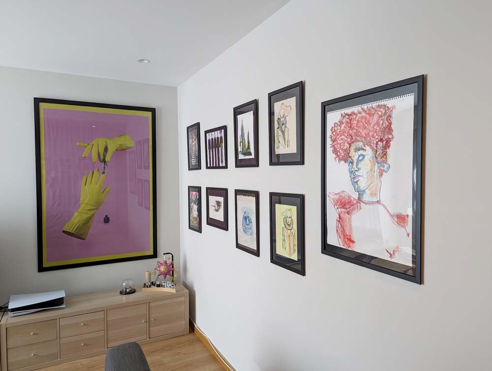 Gallery wall displaying several art pieces.