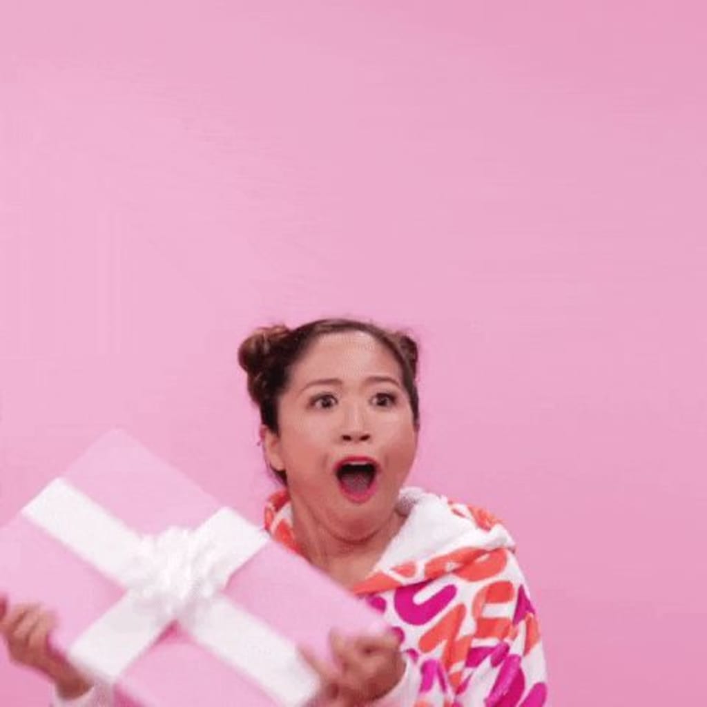 A Dunkin Donut customer jumps for joy after receiving a gift.
